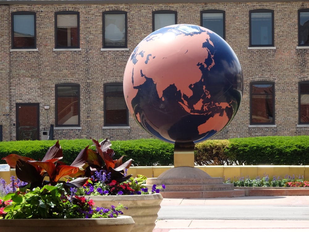 blue and red globe on white table