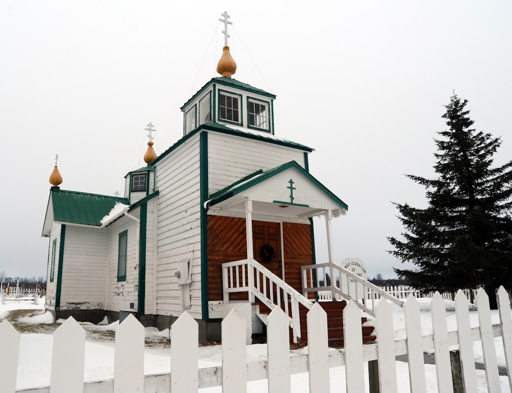 white and green wooden house