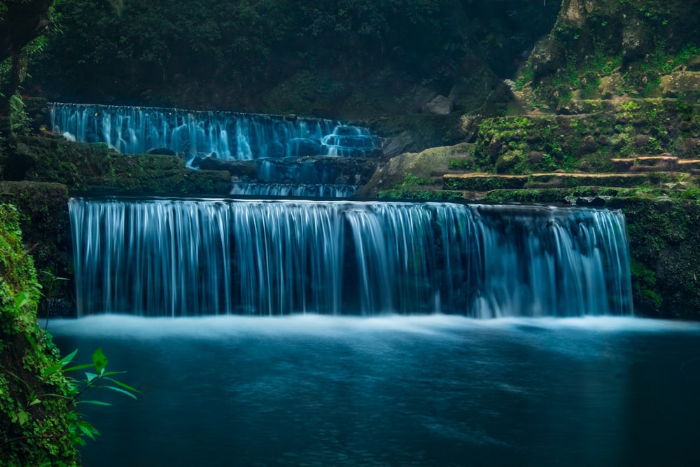 waterfalls in the middle of the forest