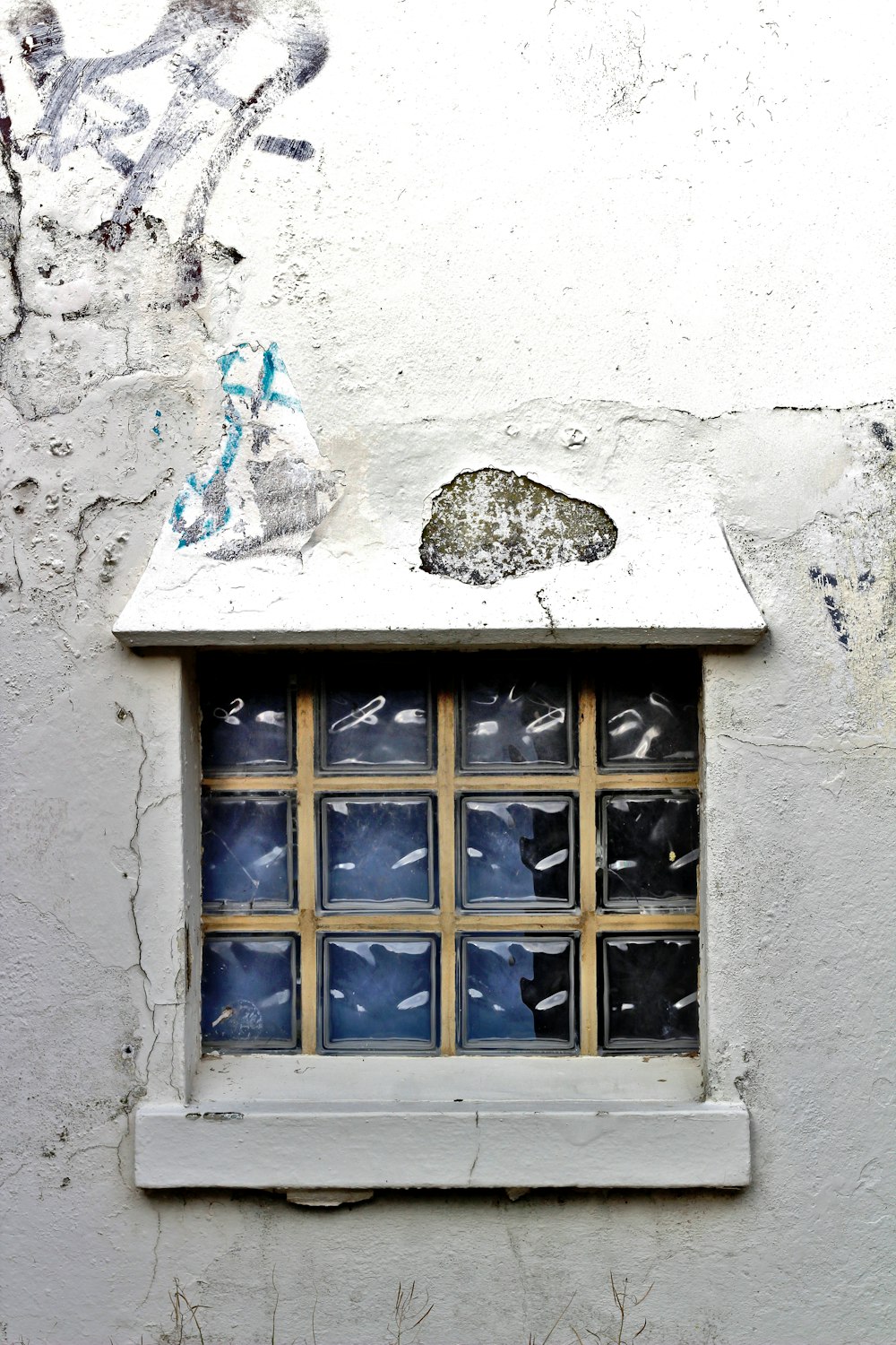 blue wooden framed glass window