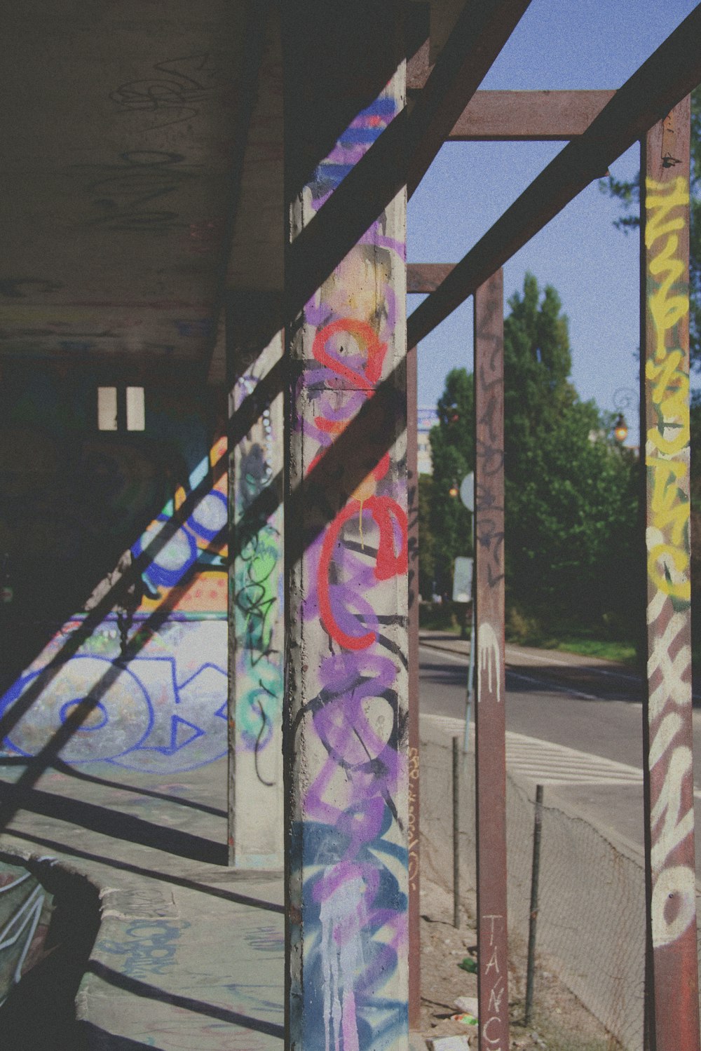 purple yellow and blue graffiti on wall