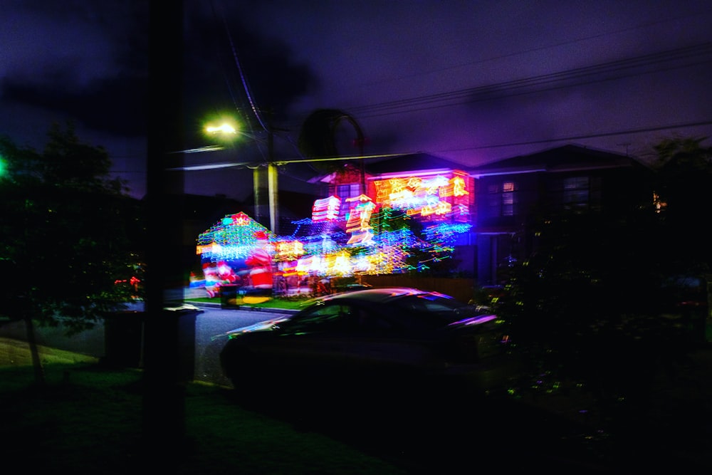 cars parked in front of store during night time