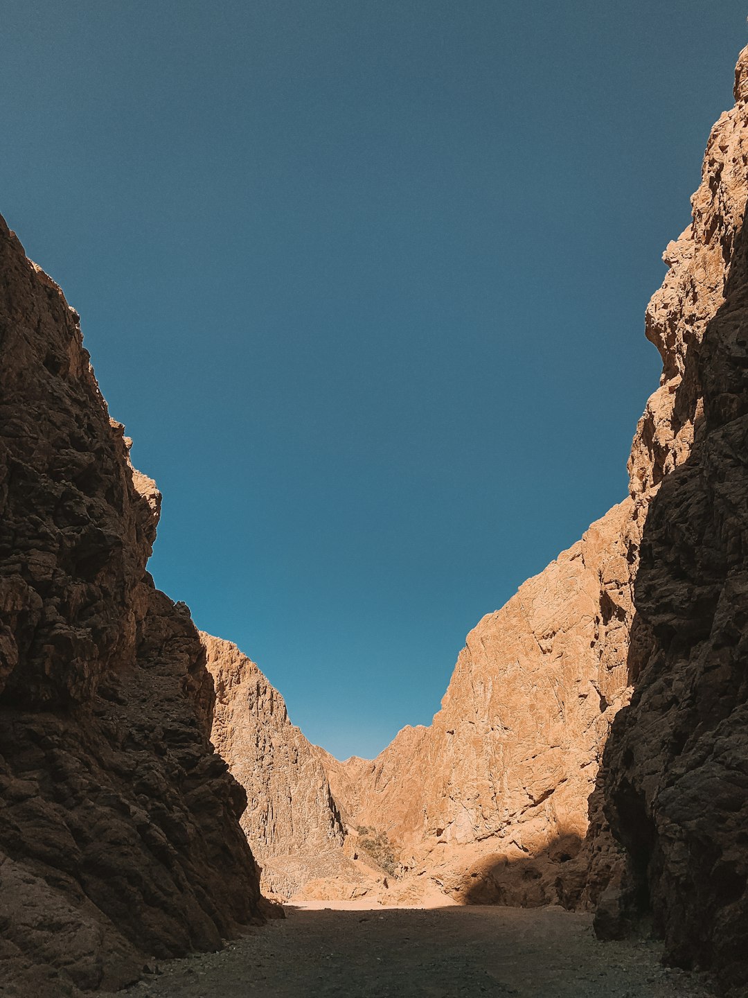 brown rocky mountain under blue sky during daytime