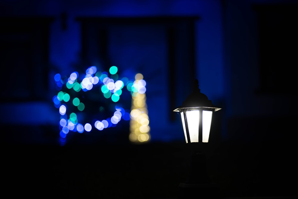 black lamp with white green and blue lights