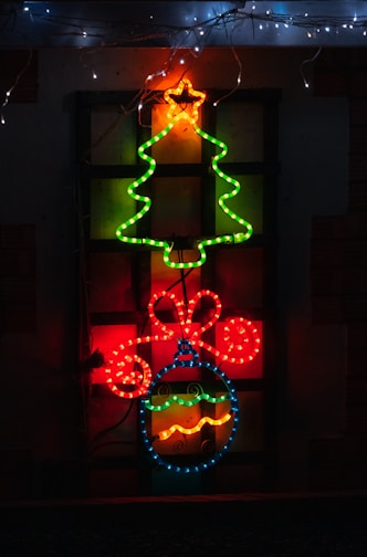 Bright and colorful modern Christmas card decorations displayed with festive lights.