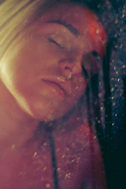 Softly lit image of a patient undergoing a chemical peel treatment with visible glowing skin