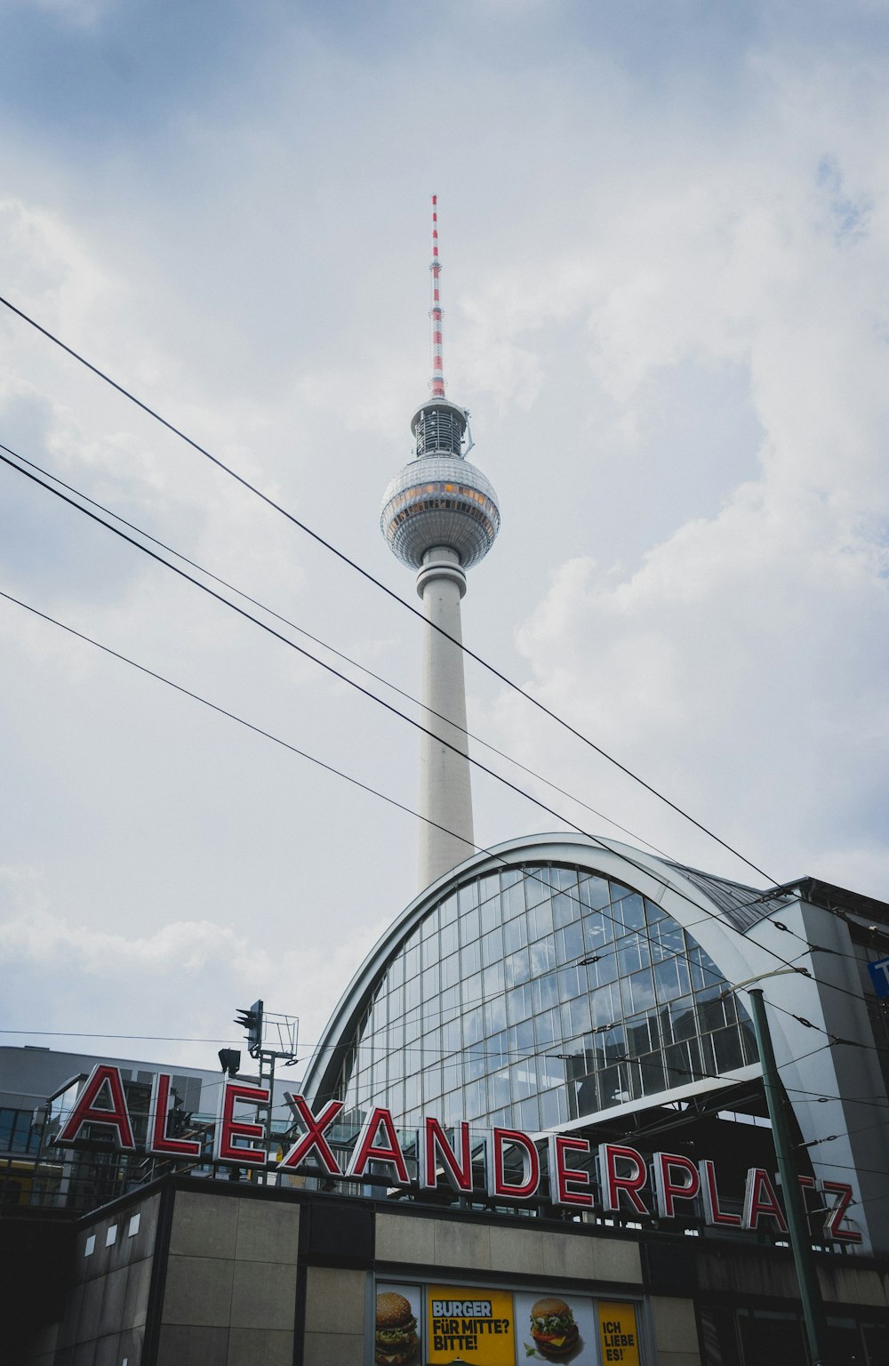 white and gray tower under cloudy sky during daytime