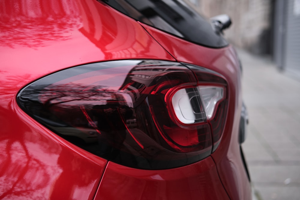 red car in close up photography