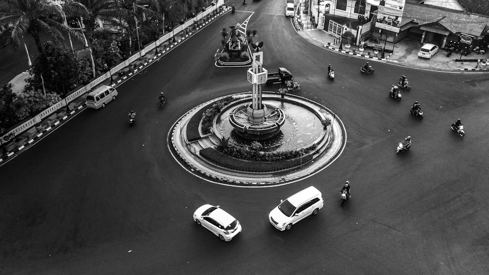 grayscale photo of cars on road