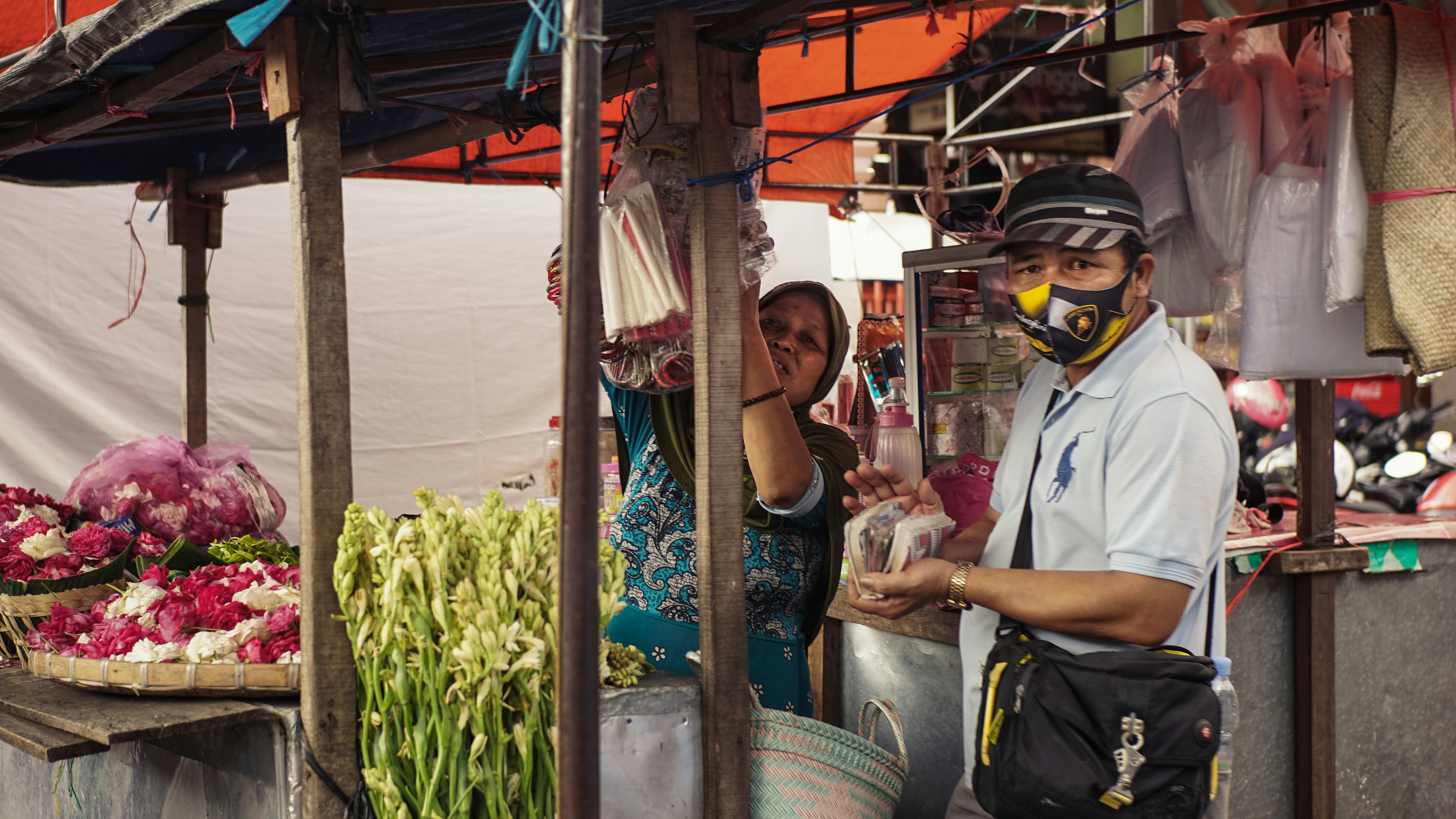 man in white polo shirt wearing black helmet