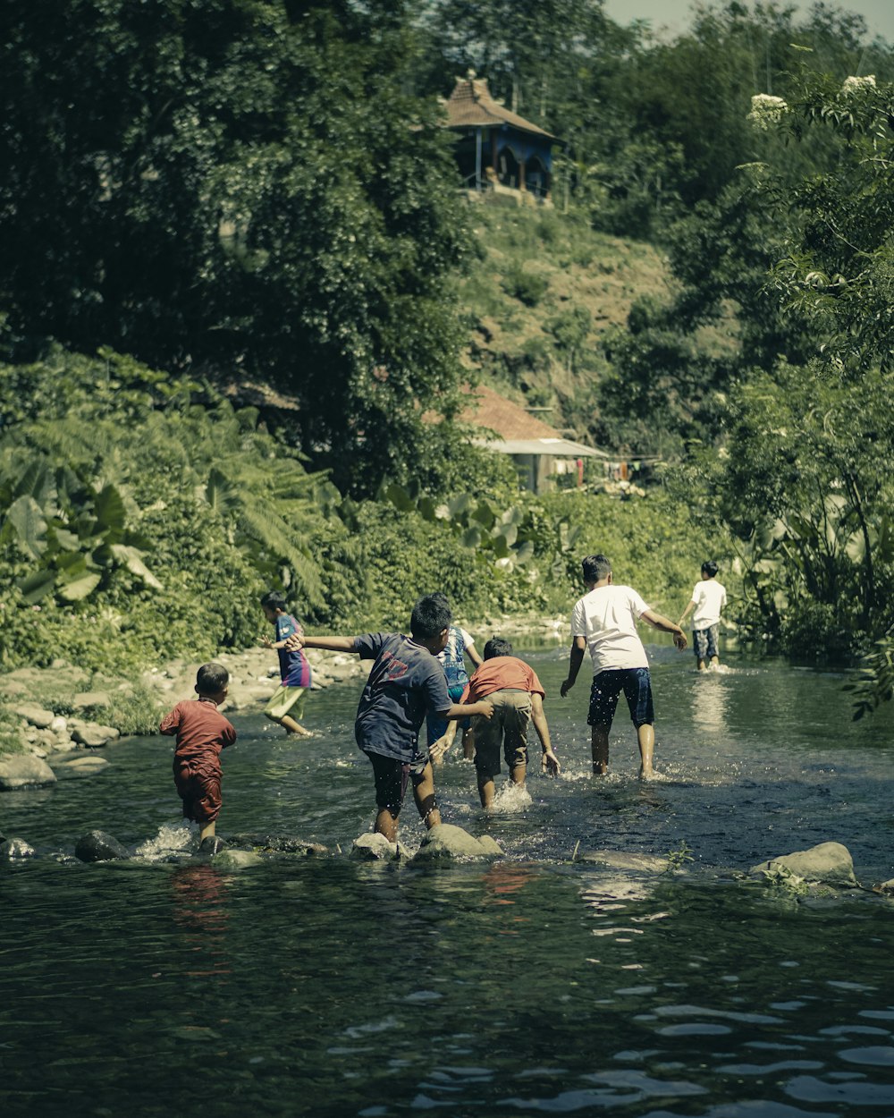 people on river during daytime