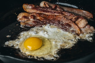 fried egg on black pan