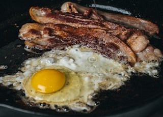 fried egg on black pan