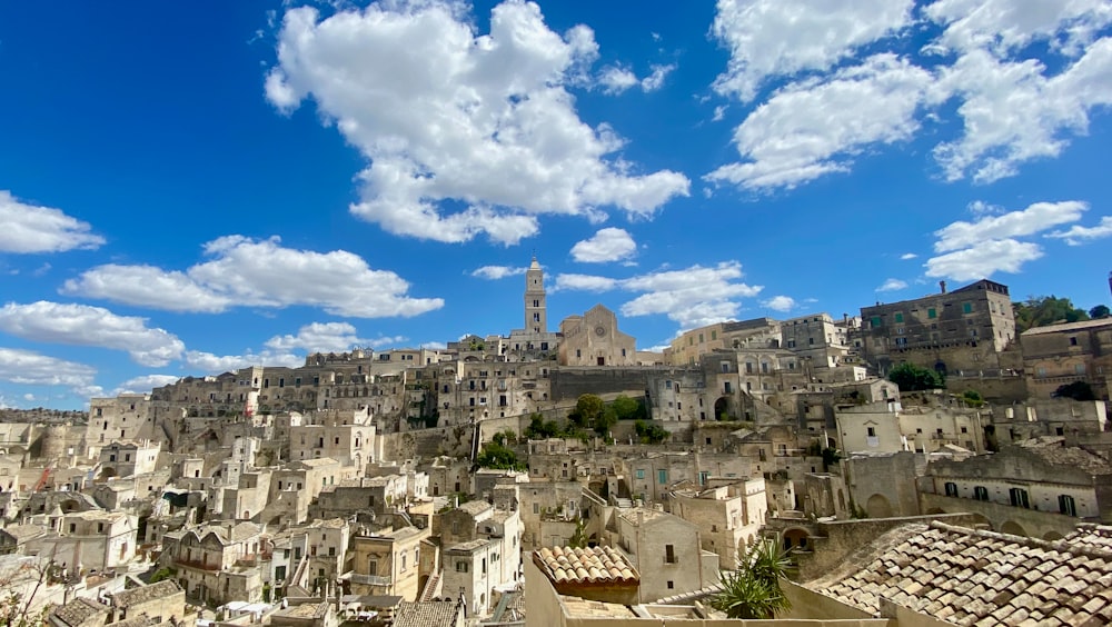 white and brown concrete buildings under blue sky during daytime