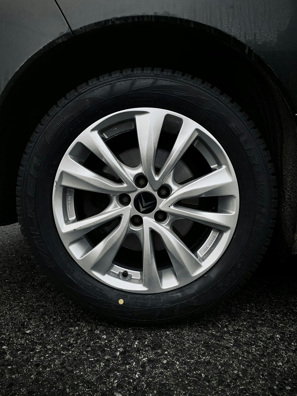 silver 5 spoke wheel with tire