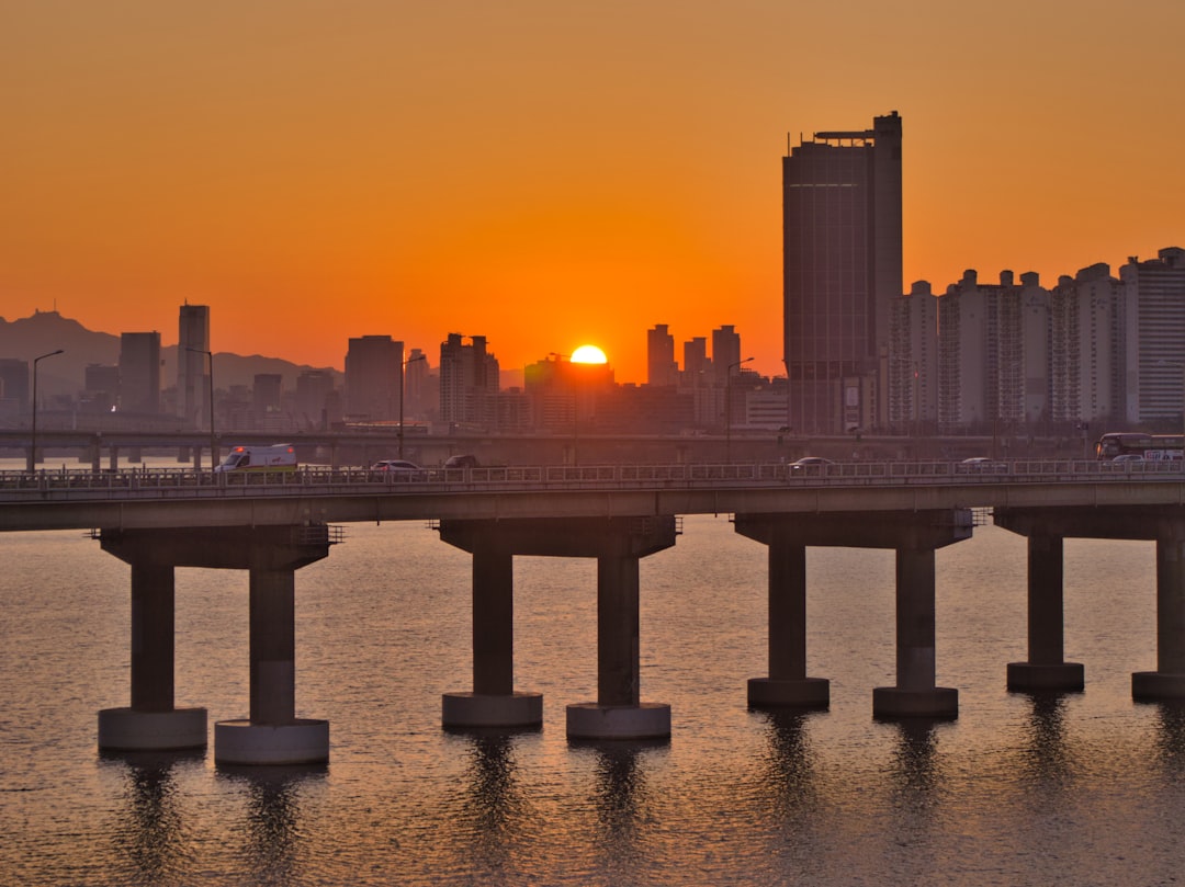 bridge over water during sunset