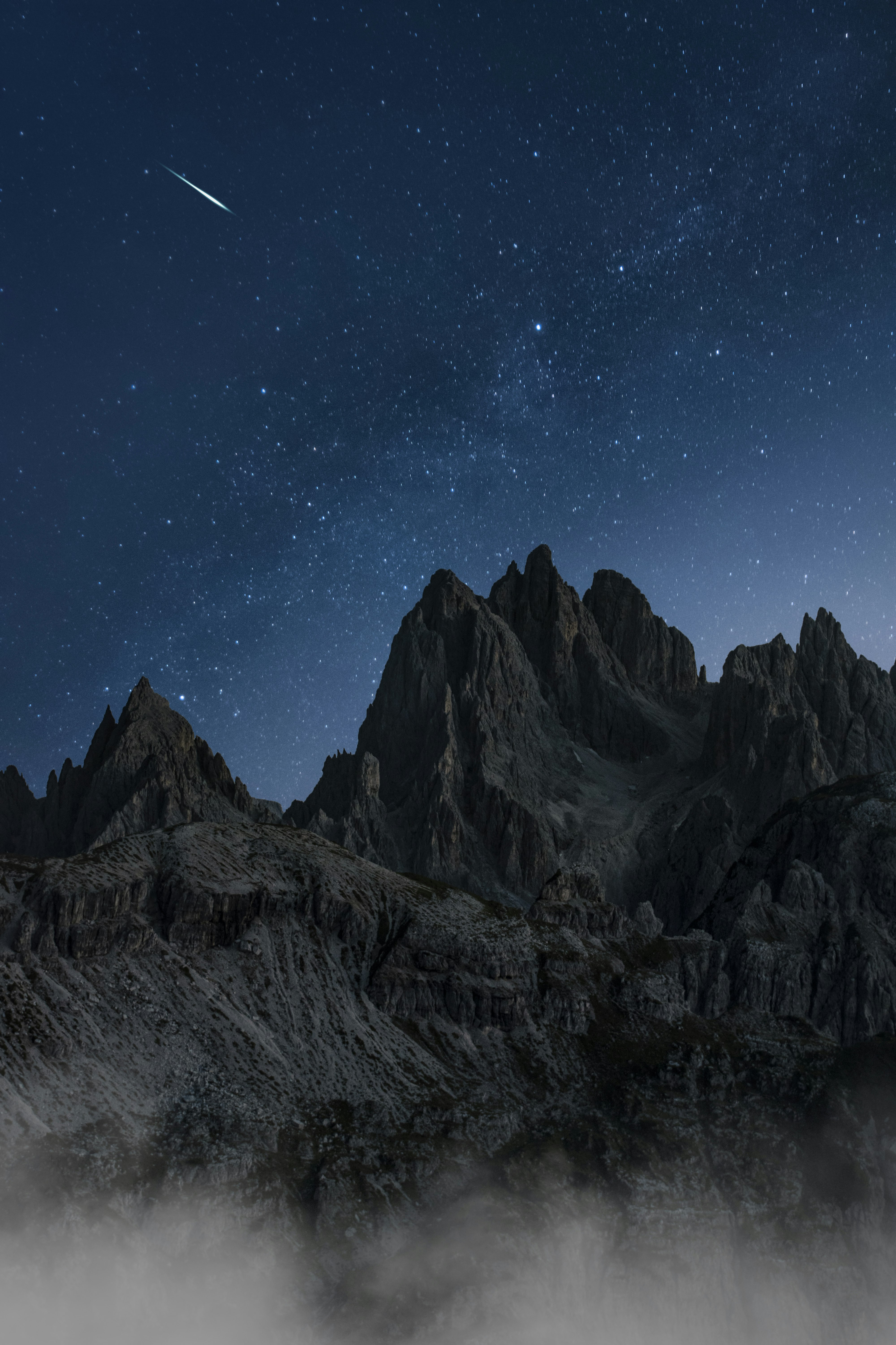 black and white mountain under blue sky