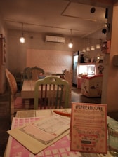 A cozy cafe interior featuring pastel decor and comfortable seating arrangements.