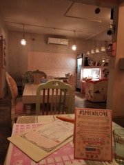 A cozy and inviting coffee shop interior with pastel colors.