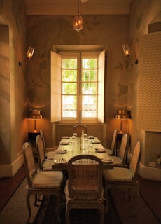 Custom wooden dining set with elegant chairs in a bright room.