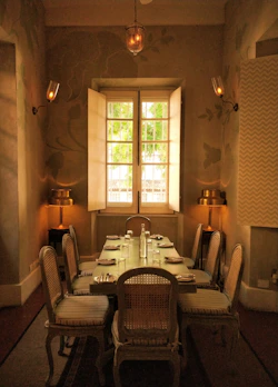 Elegant wooden dining table set in a bright room.