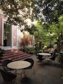 A serene outdoor space with greenery and seating.