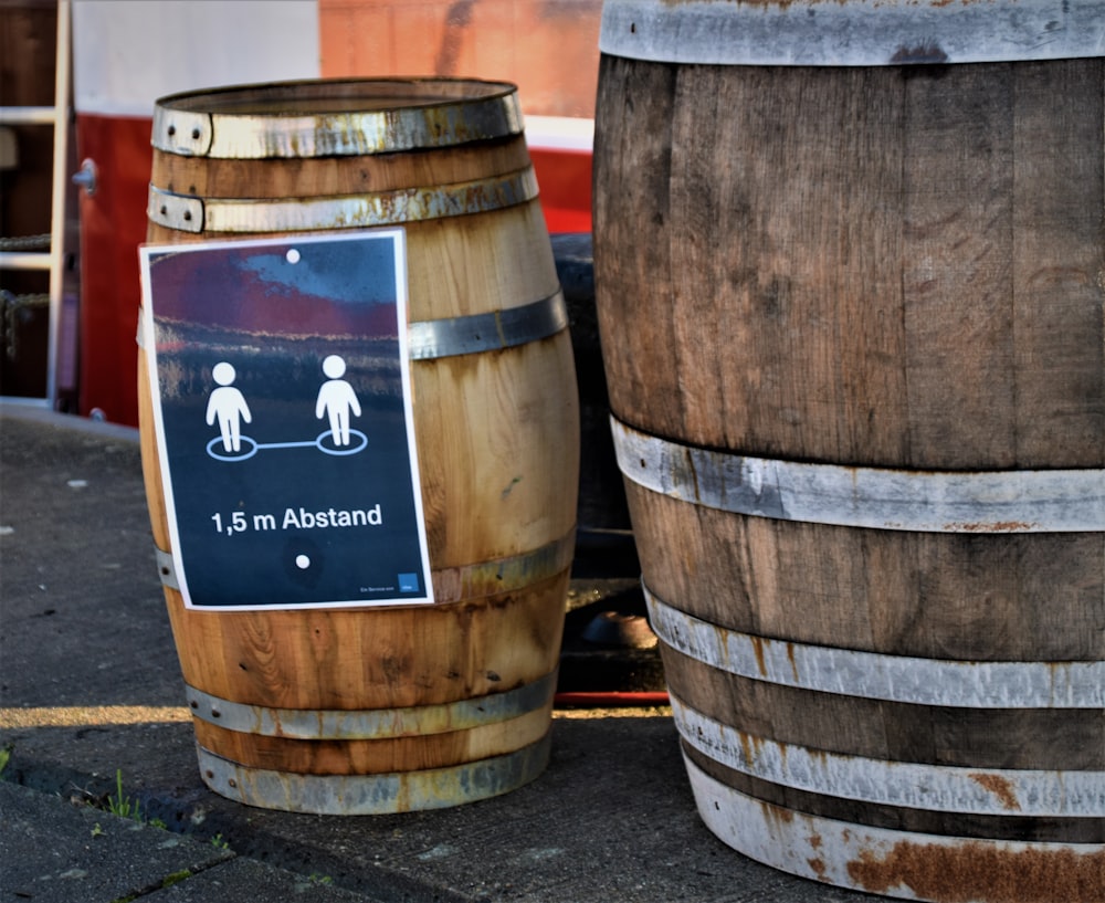 brown wooden barrels on gray concrete floor