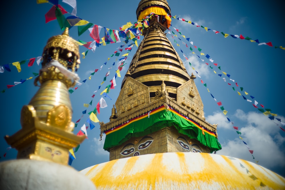 low angle photography of green and gold temple