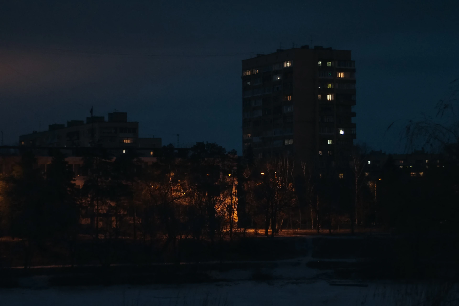 woman wearing yellow long-sleeved dress under white clouds and blue sky during daytime