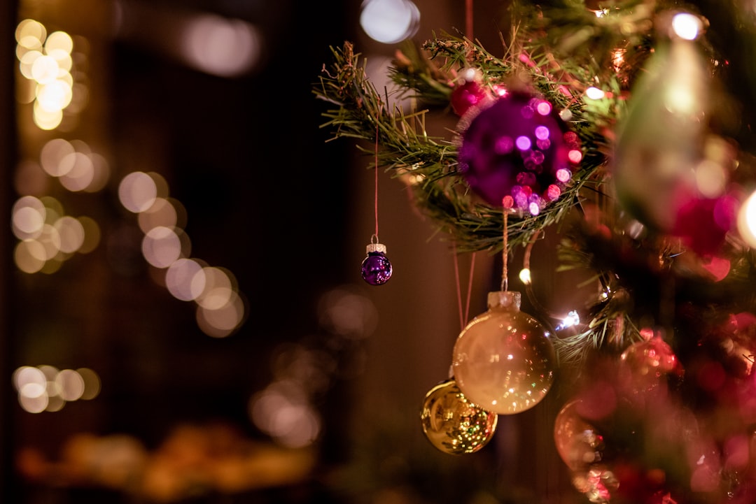 selective focus photography of pink and gold baubles