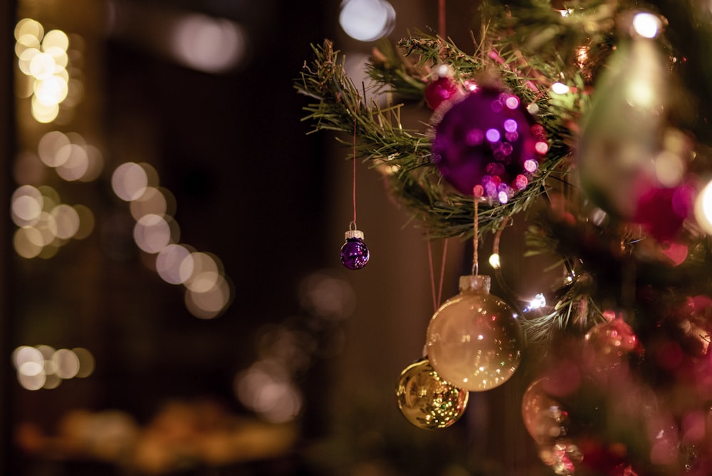 selective focus photography of pink and gold baubles