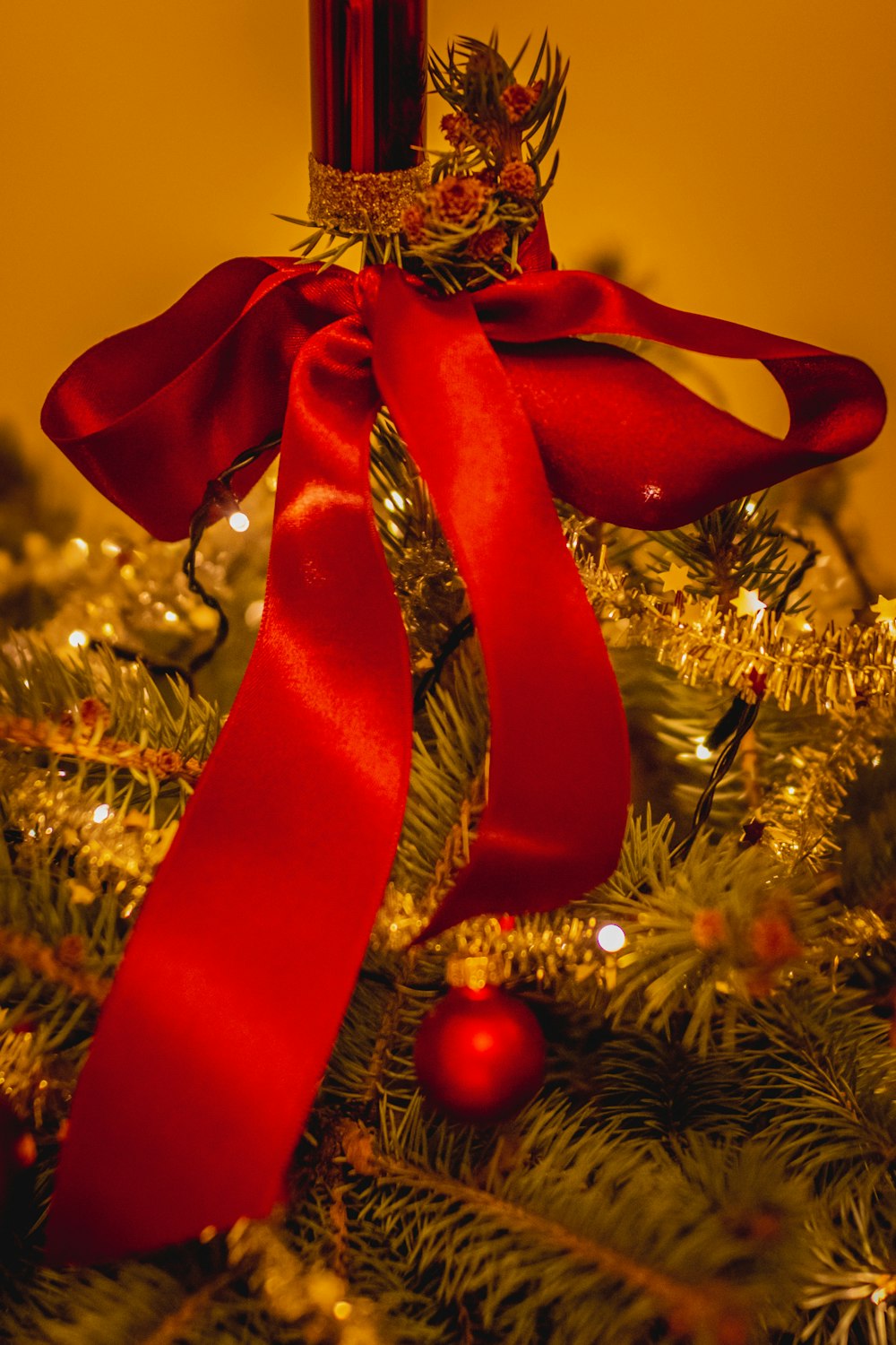 red ribbon on christmas tree