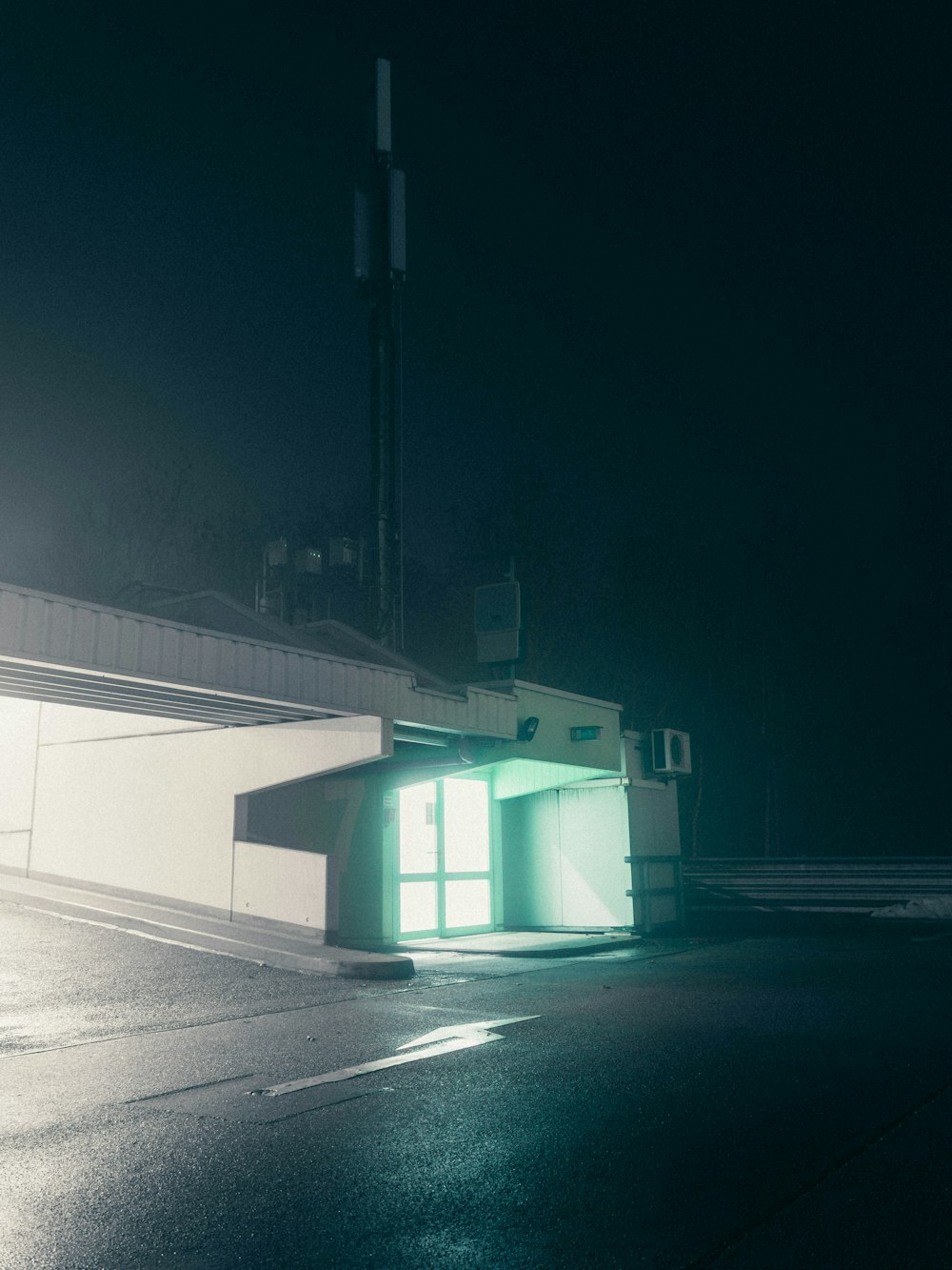 white and green building during night time