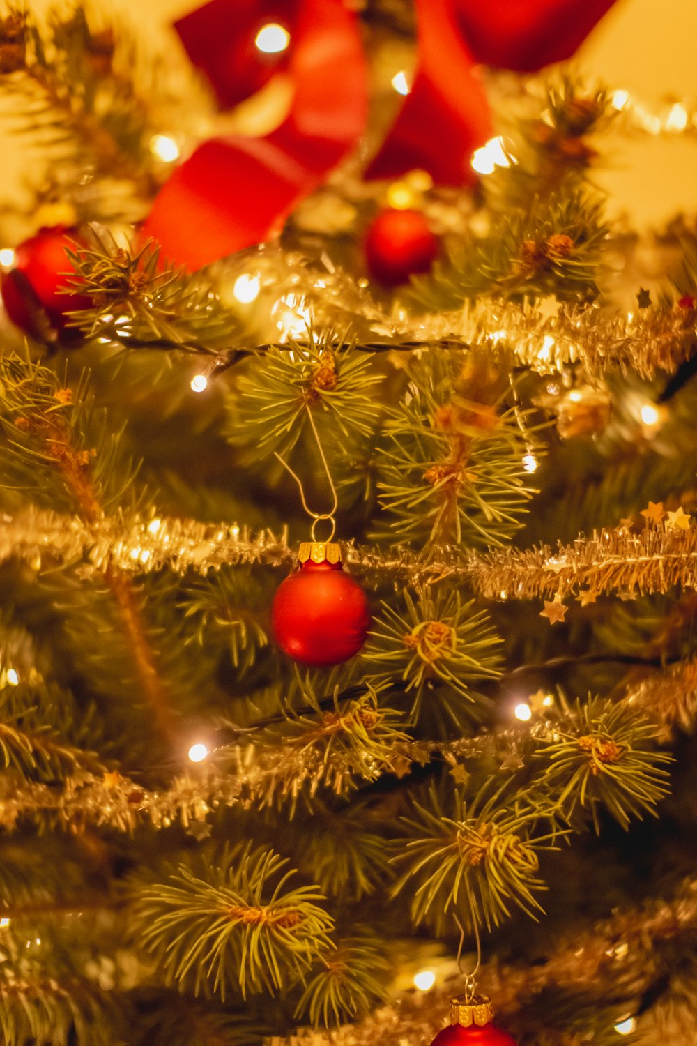 red baubles on green christmas tree