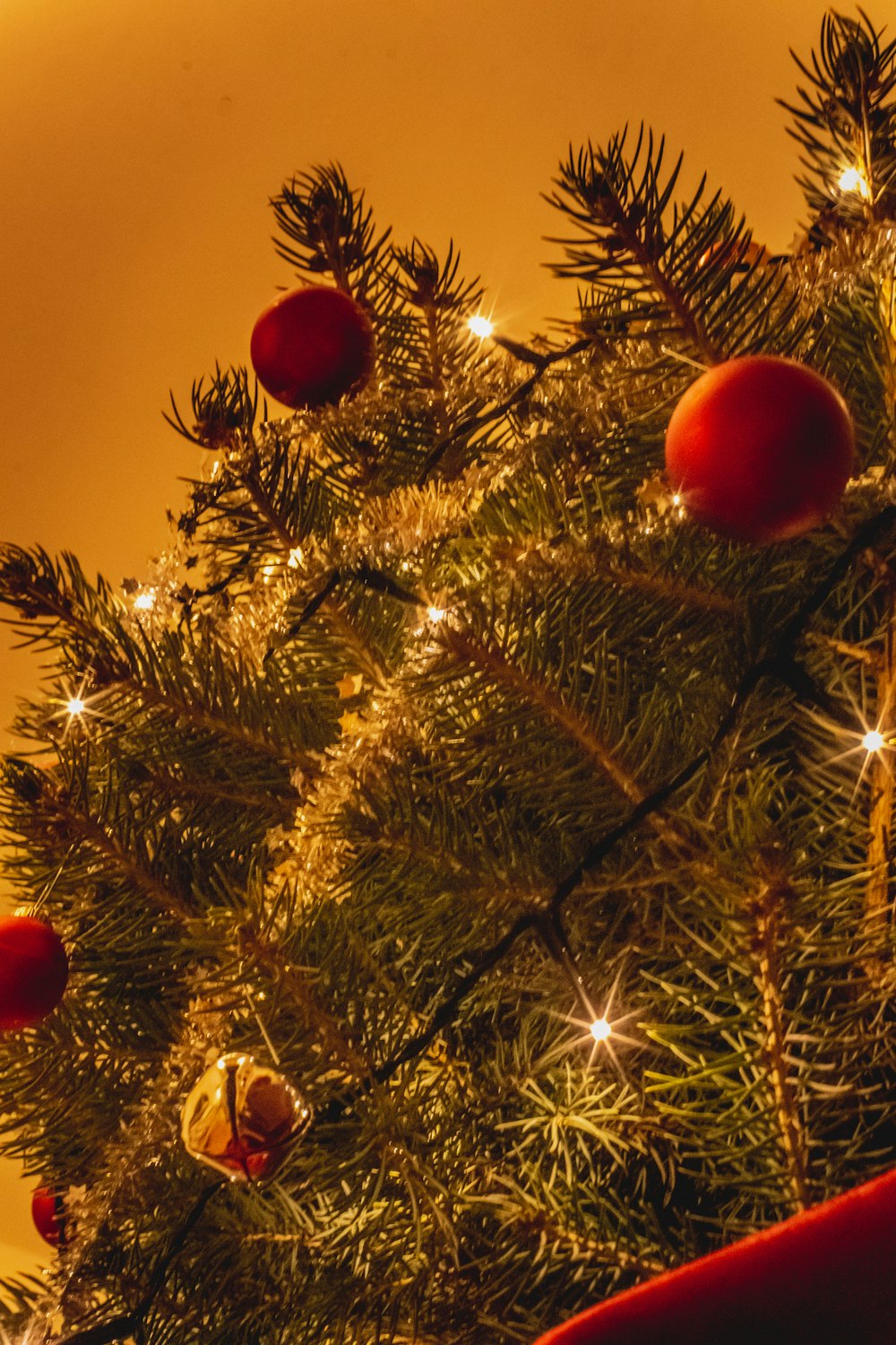 red baubles on green christmas tree