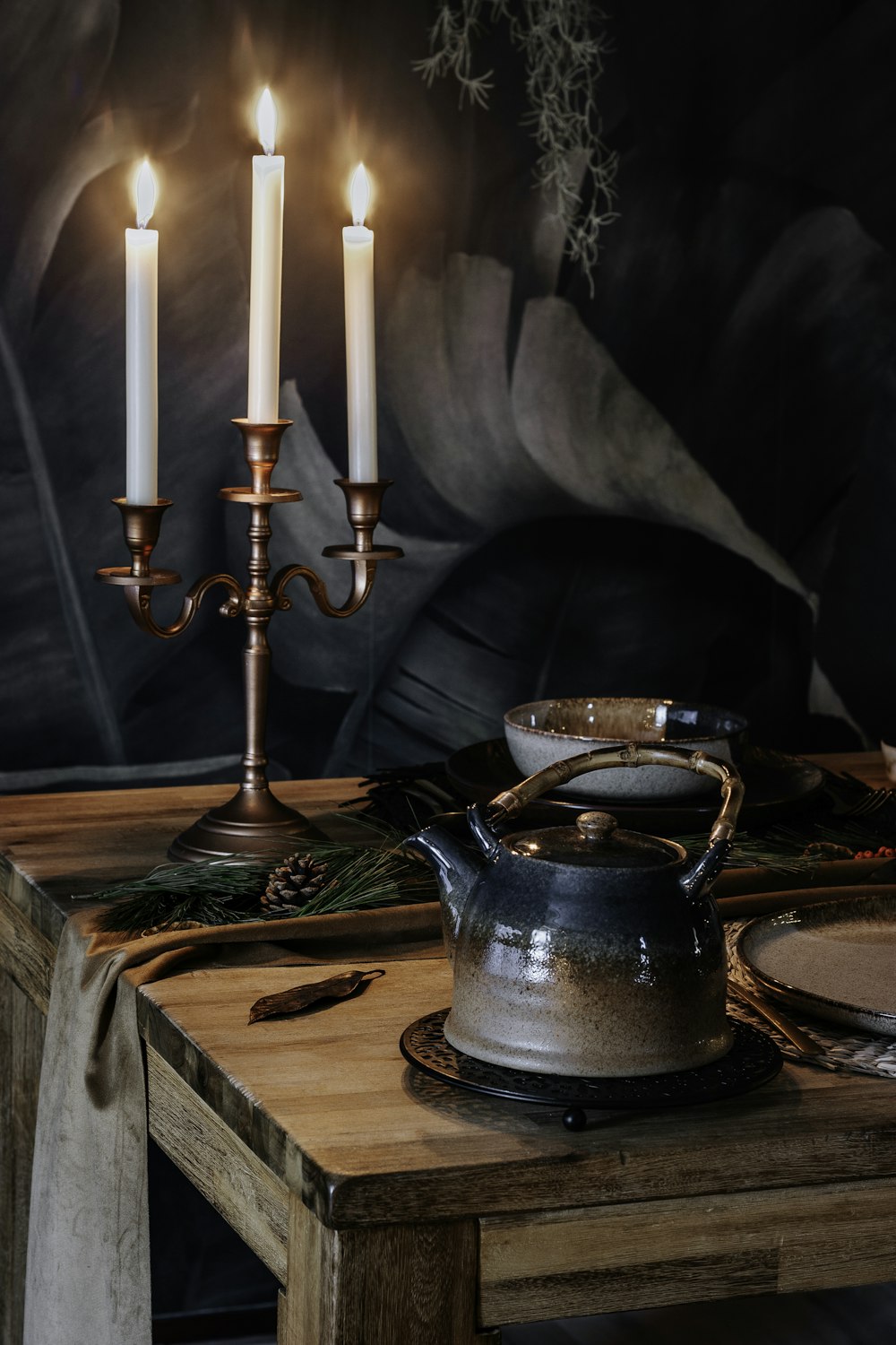 blue ceramic teapot on brown wooden table