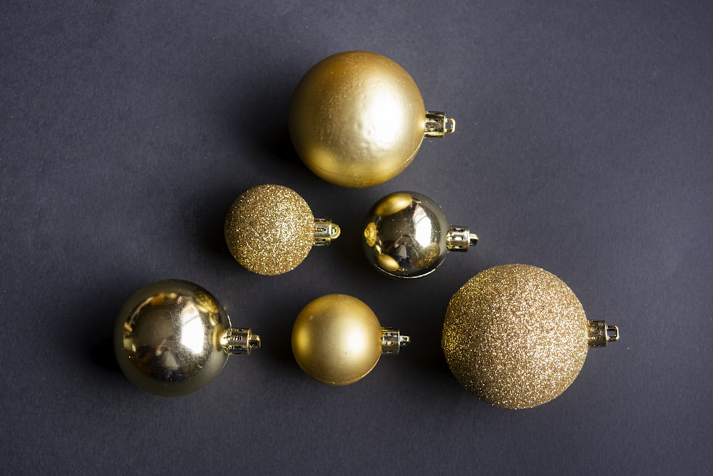gold and silver baubles on gray surface