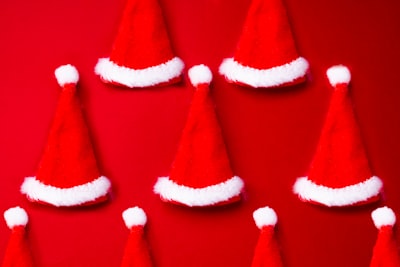 red and white santa hat santa claus teams background