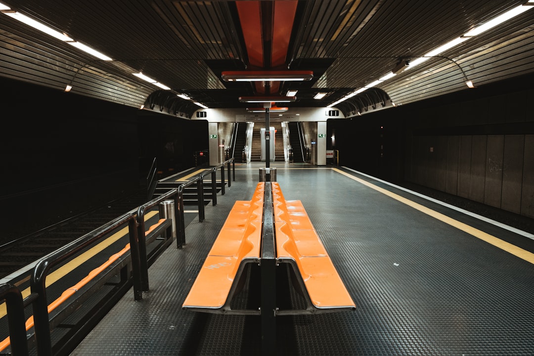 black and brown escalator in a train station