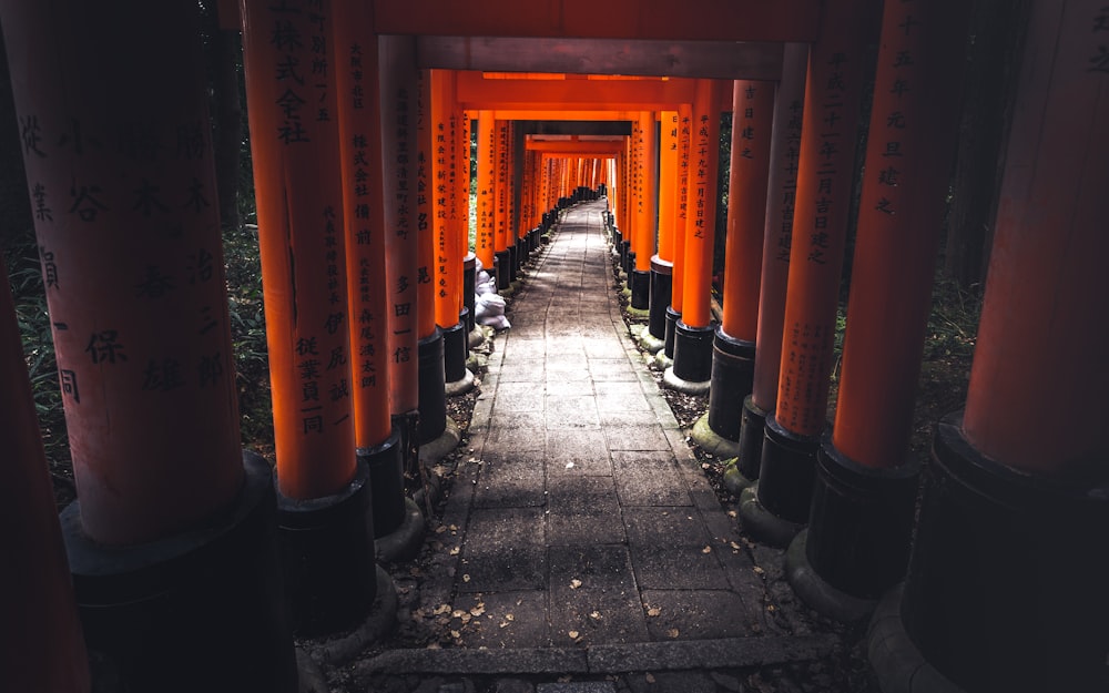 red and black hallway with red and yellow posts