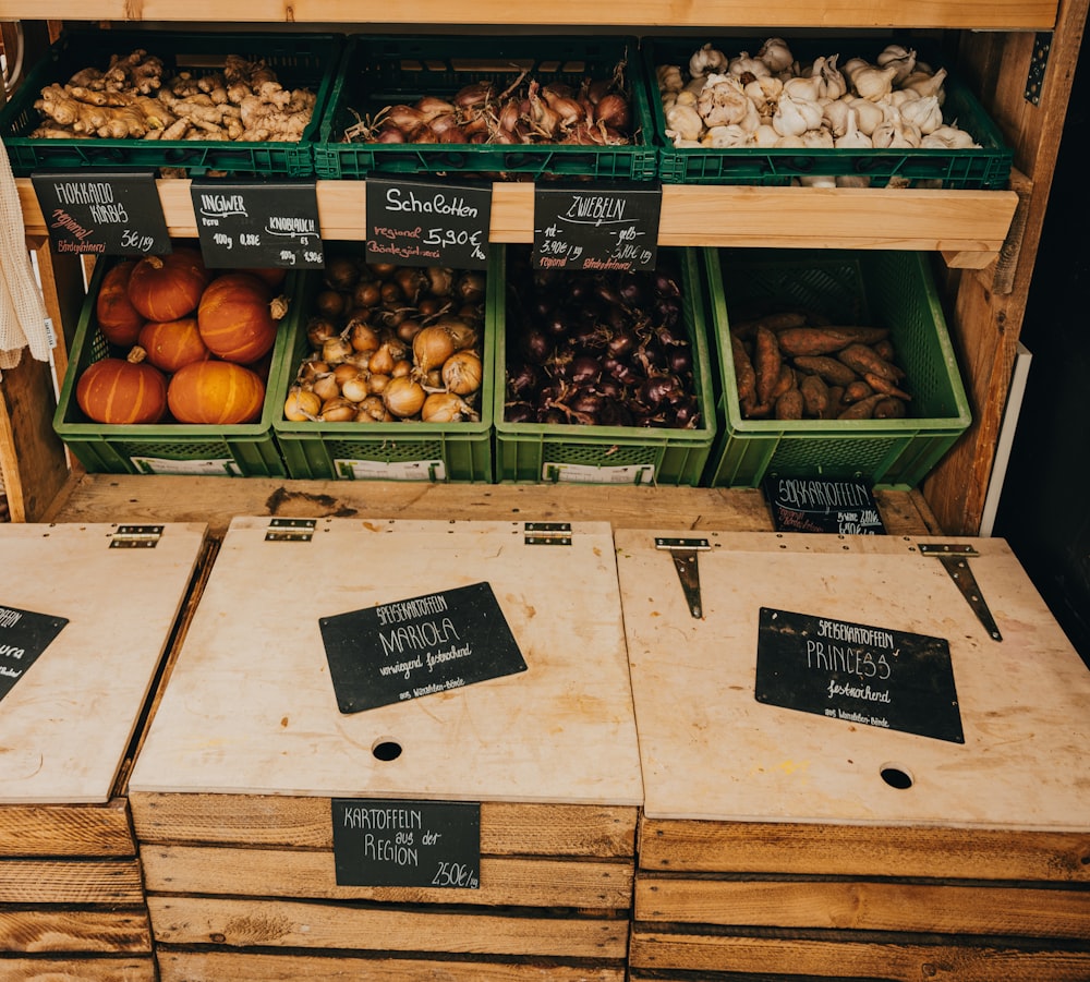 green and brown fruit on brown wooden crate