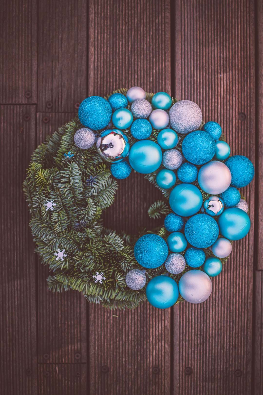 red and blue baubles on green pine tree