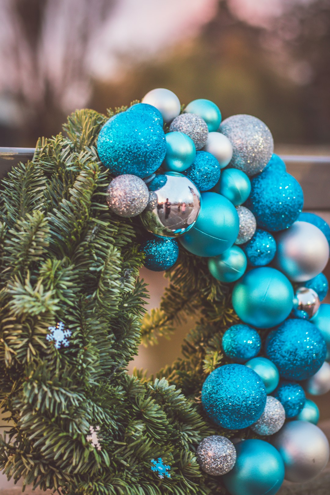 blue and silver baubles on green pine tree