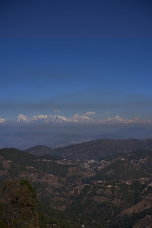 green and brown mountains under blue sky during daytime