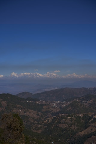 green and brown mountains under blue sky during daytime