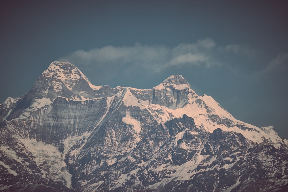 snow covered mountain under blue sky