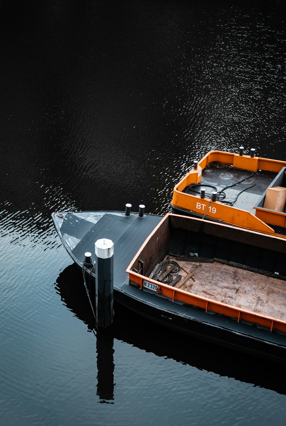 white and brown boat on body of water during daytime