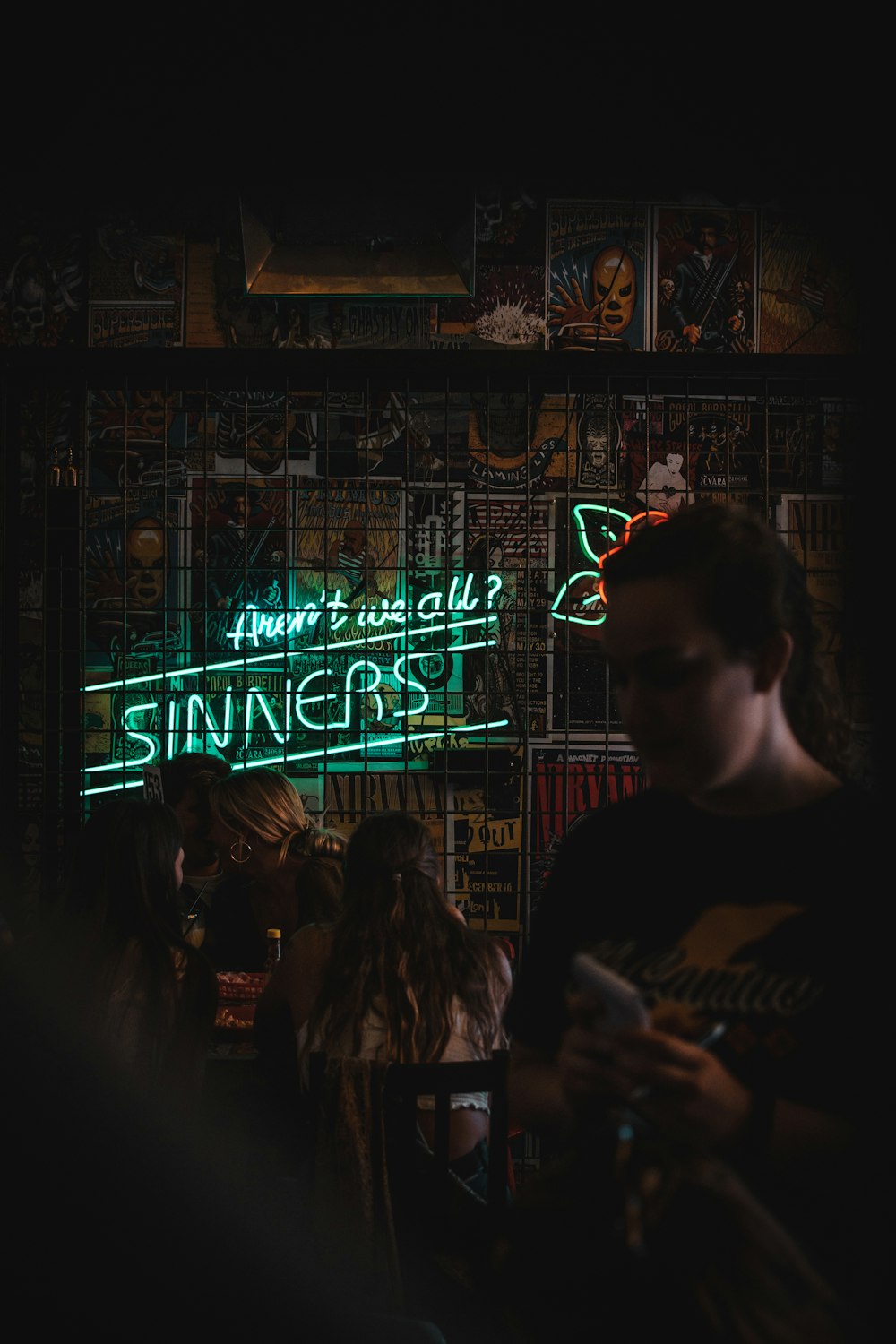 people standing in front of store during night time