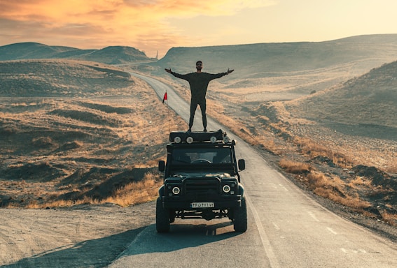 black jeep wrangler on road during daytime