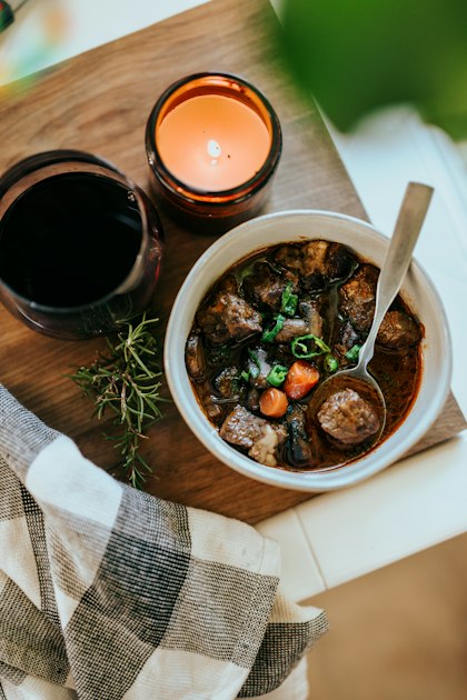 Finished beef sinigang in a white ceramic bowl, ready to serve with steamed rice